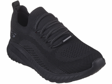 Load image into Gallery viewer, A pair of black Skechers work relaxed fit slip-resistant shoes with a mesh upper and memory foam insole.
