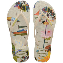 Load image into Gallery viewer, A pair of Havaianas slim summer bliss flip-flops with a multicolored floral pattern.