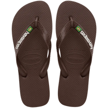 Load image into Gallery viewer, Havaianas dark brown flip-flops featuring white branding text, a small Brazilian flag emblem on the strap, and textured soles