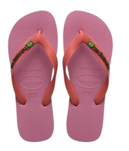 Load image into Gallery viewer, Product photography Havaianas pair of pink flip-flops with coral straps featuring the black Havaianas logo and a Brazilian flag emblem
