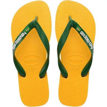 Load image into Gallery viewer, A pair of yellow Havaianas flip-flops with dark green textured straps featuring the brand logo and a small Brazilian flag icon