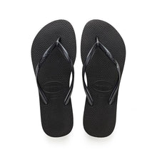 Load image into Gallery viewer, Product photograph Havaianas black flip-flops showcasing the brand name on both the textured straps and the dimpled sole