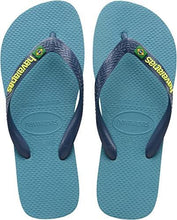 Load image into Gallery viewer, Photograph of Havaianas teal blue flip-flops with textured soles, navy blue straps, yellow logo lettering, and a small Brazilian flag emblem