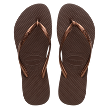 Load image into Gallery viewer, A pair of dark brown Havaianas flip-flops with metallic bronze straps featuring a subtle textured pattern and the brand logo visible on the sole and strap