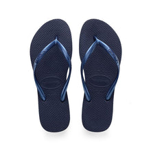 Load image into Gallery viewer, Product photo of Havaianas navy blue slim flip-flops on a white studio background, featuring textured straps with embossed Havaianas branding and a signature rice grain pattern on the sole