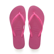Load image into Gallery viewer, A pair of bright pink Havaianas flip-flops featuring textured soles and straps with the brand logo
