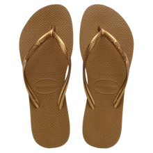 Load image into Gallery viewer, Havaianas product photography of a pair of golden brown flip-flops with metallic bronze straps featuring a subtle braided pattern and the brand logo embossed on the textured rice-grain sole