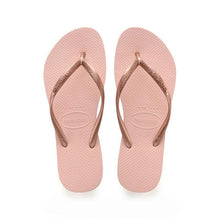 Load image into Gallery viewer, Product photography of blush pink Havaianas flip-flops featuring textured soles and metallic rose gold straps embossed with the brand name and size 37-38 on a white studio background