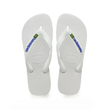 Load image into Gallery viewer, A pair of white rubber Havaianas flip-flops features blue Havaianas branding and a small Brazilian flag emblem on each strap with textured soles and 'Havaianas Brasil' embossed details