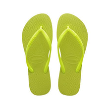 Load image into Gallery viewer, Digital image featuring vibrant lime green Havaianas flip-flops with a textured rubber sole and distinct brand logos on the straps and heel