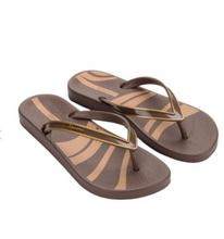 Load image into Gallery viewer, A pair of brown and tan striped flip-flop sandals with metallic gold straps, shown on a plain white background.
