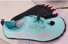 Load image into Gallery viewer, A light blue water shoe with pink 'NEW WAVE' branding on the side, shown alongside another shoe showing the black microfiber sole with pink toes.
