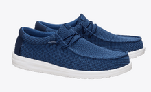 Load image into Gallery viewer, Pair of blue textured shoes with white soles on a white background
