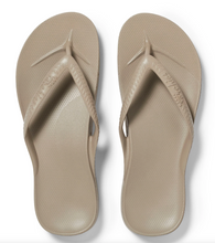 Load image into Gallery viewer, Pair of beige flip-flops on a white background
