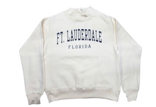 Load image into Gallery viewer, An off-white crewneck sweatshirt with 'FT. LAUDERDALE' and 'FLORIDA' printed in navy blue collegiate lettering on the chest, displayed flat against a white background.
